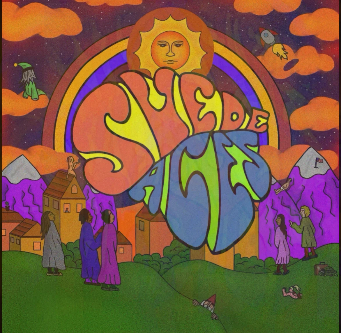 Suede Aces album cover: a psychedelic illustration of the hand-lettered band name under a smiling sun and rainbow, above purple mountains and a hillside village